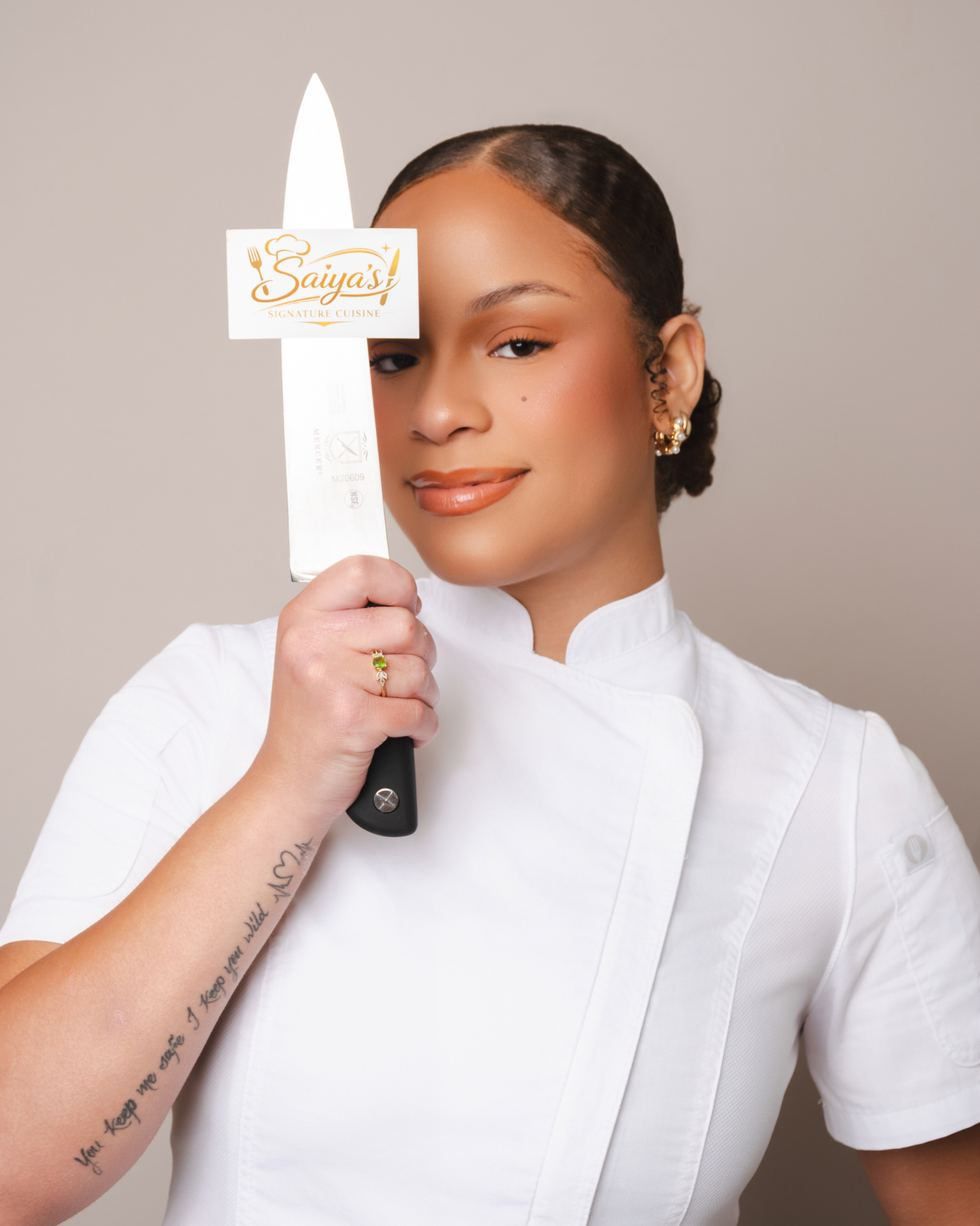 Chef Saiya in a white chef coat